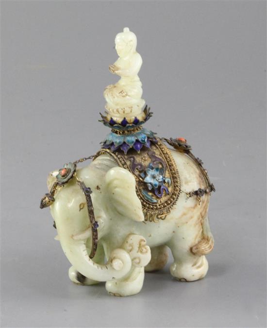 A Chinese celadon jade and filigree work group of Buddha riding an elephant, early 20th century, total height 14.5cm, length 9.8cm